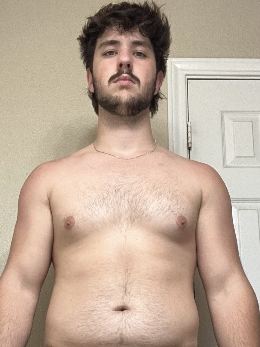 Alan before, overweight, standing shirtless at home